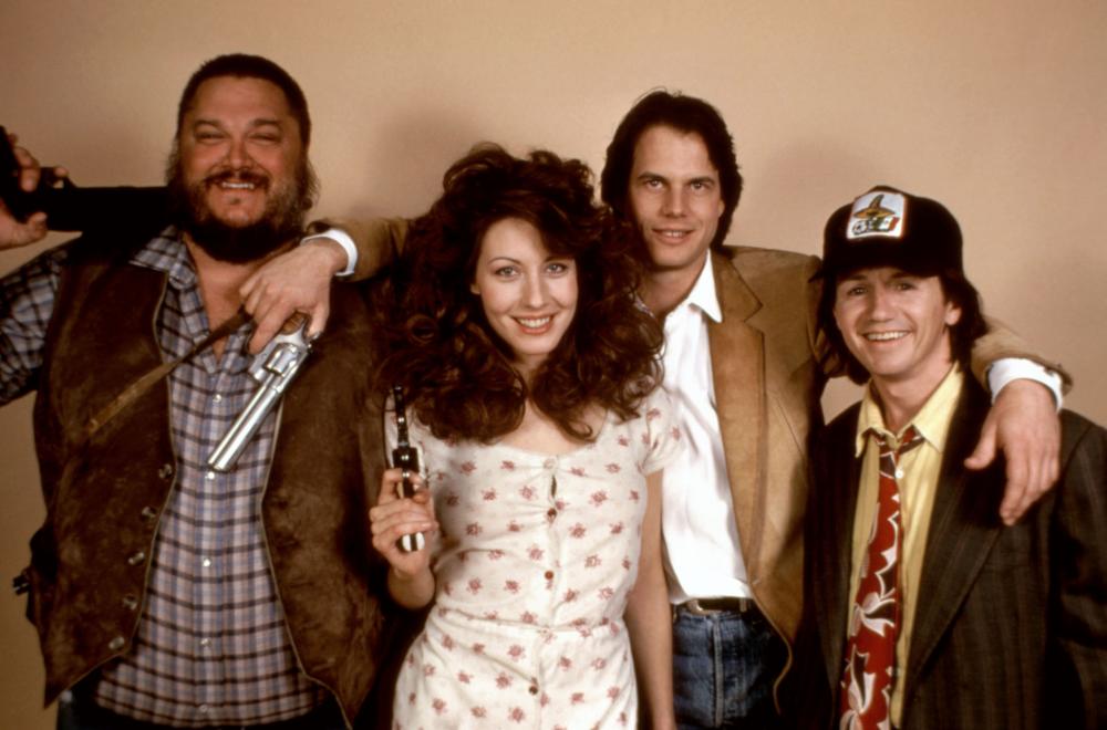 PASS THE AMMO, Dennis Burkley (far left), Linda Kozlowski (second from left), Bill Paxton (third from left), 1988. ©New Century Vista Film