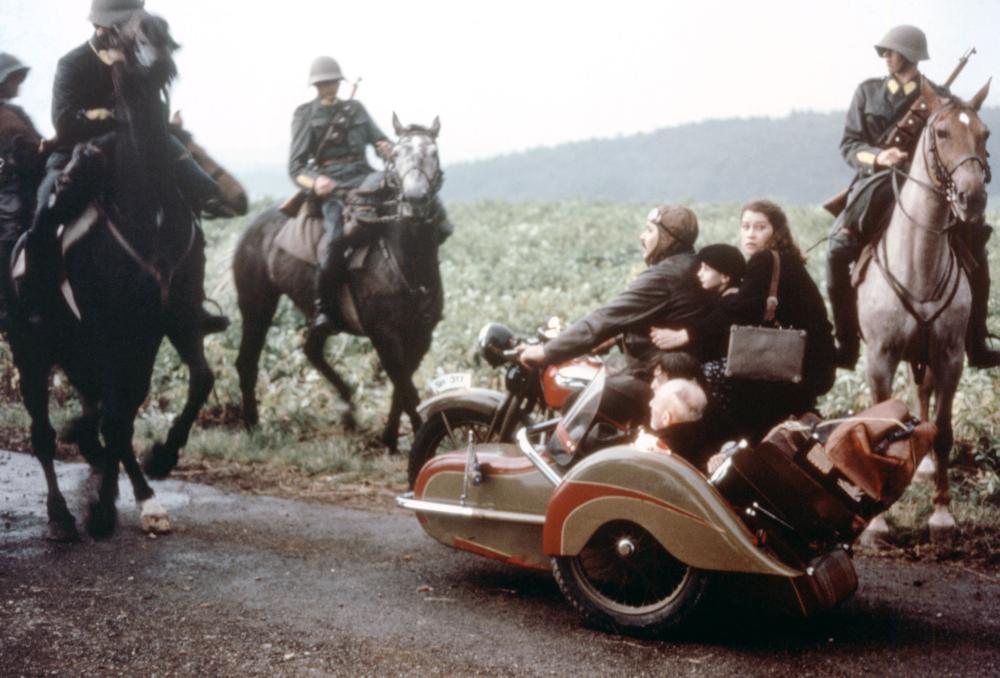 THE BOAT IS FULL, (aka DAS BOOT IST VOLL), (on motorcycle), Mathias Gnadinger, Laurent, Renate Steiger, 1981, (c) Quartet Films